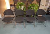 4 Black and Chrome Stackable Chairs