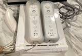wii console w/ remotes and game