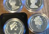 four Canada proof dollars