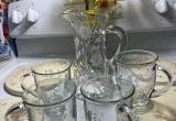 heavy cut glass pitcher with 4 cups
