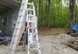 multiple aluminum ladders