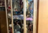 Curio cabinet with 15 poraclain dolls