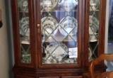 Wood china cabinet with glass doors