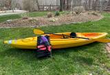 Kayak, paddle, life vest